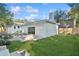 Home features a grassy backyard and patio at 1504 E Robinson St, Orlando, FL 32801