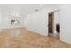 Well-lit room with neutral walls, tile flooring, and a view into a bathroom with a stone vanity at 1504 E Robinson St, Orlando, FL 32801
