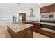 Modern kitchen featuring granite countertops, stainless steel appliances, and a large island with sink at 1504 E Robinson St, Orlando, FL 32801