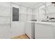 Laundry room with washer, dryer and ample shelving at 1504 E Robinson St, Orlando, FL 32801