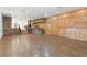 Spacious room featuring wood accents, a brick bar, and access to other areas for seamless entertainment at 1504 E Robinson St, Orlando, FL 32801