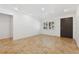 Bright living room featuring neutral walls and beautiful tile flooring illuminated by recessed lighting at 1504 E Robinson St, Orlando, FL 32801