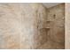 Beautifully tiled shower featuring stone colored tile, a shower head, and built in shelving at 1504 E Robinson St, Orlando, FL 32801