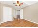 Bedroom with hardwood floors and ceiling fan at 305 Lakepointe Dr # 101, Altamonte Springs, FL 32701