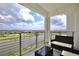 Relaxing balcony overlooking a lake and community amenities at 3151 Paradox Cir # 405, Kissimmee, FL 34746