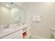 Double vanity bathroom with modern finishes and storage at 3151 Paradox Cir # 405, Kissimmee, FL 34746