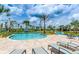 Relaxing resort-style pool with lounge chairs and a lazy river at 3151 Paradox Cir # 405, Kissimmee, FL 34746