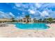 Large resort-style pool with plenty of lounge chairs at 3151 Paradox Cir # 405, Kissimmee, FL 34746