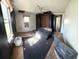 Small bedroom with window, closet, and a couch at 475 80 Foot Rd, Bartow, FL 33830