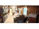 Open dining area with wood-paneled walls and a large fish tank at 475 80 Foot Rd, Bartow, FL 33830