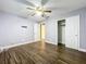 Bedroom with hardwood floors and mirrored closet doors at 4804 Lake Ridge Rd # 10, Orlando, FL 32808