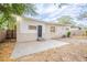 Home's backyard with a patio and mature trees at 5219 Montague Pl, Orlando, FL 32808