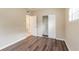 Charming bedroom with wood-look floors and a large closet at 5219 Montague Pl, Orlando, FL 32808