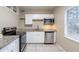Updated kitchen with granite countertops and stainless steel appliances at 5219 Montague Pl, Orlando, FL 32808
