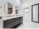 Bathroom boasts double vanity and marble countertops at 527 Broadway Ave, Orlando, FL 32803