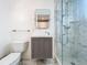 Modern bathroom with gray vanity and marble shower at 527 Broadway Ave, Orlando, FL 32803