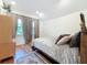 Cozy bedroom with hardwood floors and large windows at 527 Broadway Ave, Orlando, FL 32803