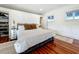 Bright bedroom with ample closet space and hardwood floors at 527 Broadway Ave, Orlando, FL 32803
