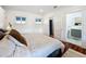 Spacious primary bedroom with ensuite bathroom and hardwood floors at 527 Broadway Ave, Orlando, FL 32803
