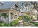 White house with a wrap-around porch and brick walkway at 527 Broadway Ave, Orlando, FL 32803