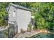 Charming cottage with gray block exterior, deck and lush landscaping at 527 Broadway Ave, Orlando, FL 32803