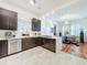 Updated kitchen features dark cabinetry and breakfast bar at 527 Broadway Ave, Orlando, FL 32803