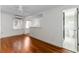 Open living space with hardwood floors and kitchen bar at 527 Broadway Ave, Orlando, FL 32803