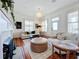 Spacious living room with hardwood floors, fireplace, and comfy furniture at 527 Broadway Ave, Orlando, FL 32803