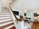 Grand staircase leads to upper level living areas at 527 Broadway Ave, Orlando, FL 32803