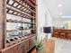 Detailed view of a wooden wine rack with wine bottles at 527 Broadway Ave, Orlando, FL 32803