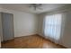 Bright bedroom with hardwood floors and window coverings at 5275 Images Cir # 105, Kissimmee, FL 34746