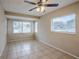 Spacious bedroom with tile floors and ceiling fan at 5511 Indian Hill Rd, Orlando, FL 32808