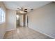Bright bedroom with tile floors and ceiling fan at 5511 Indian Hill Rd, Orlando, FL 32808