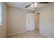 Bedroom with tile flooring, ceiling fan and access to a bathroom at 5511 Indian Hill Rd, Orlando, FL 32808