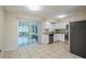 Kitchen with white cabinets, granite counters and stainless steel appliances at 5511 Indian Hill Rd, Orlando, FL 32808