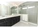 Bathroom featuring double sinks, modern fixtures, a shower, and lots of natural light at 618 Windy Pine Way, Oviedo, FL 32765
