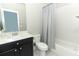 Standard bathroom featuring a vanity with a marble countertop, toilet, and shower-tub combination with a shower curtain at 618 Windy Pine Way, Oviedo, FL 32765