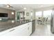 Modern kitchen featuring granite countertops, stainless steel appliances, and an open layout at 618 Windy Pine Way, Oviedo, FL 32765
