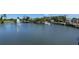 Scenic view of a lake with a fountain, surrounded by buildings and lush greenery, offering a serene atmosphere at 618 Windy Pine Way, Oviedo, FL 32765