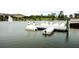 Scenic lake featuring swan paddle boats and a picturesque dock, enhancing community enjoyment at 618 Windy Pine Way, Oviedo, FL 32765