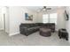 Comfortable living room with plush gray carpet, an L-shaped sofa, and plenty of natural light at 618 Windy Pine Way, Oviedo, FL 32765