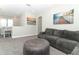 Cozy loft area with a comfortable sofa and artwork, perfect for relaxing at 618 Windy Pine Way, Oviedo, FL 32765