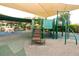 Community playground featuring a modern play structure, covered seating, and soft surface at 618 Windy Pine Way, Oviedo, FL 32765