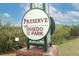 Sign for the 'Preserve of Oviedo on the Park' surrounded by greenery at 618 Windy Pine Way, Oviedo, FL 32765