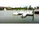 Swan paddle boats at a dock on the lake with fountain in the background, creating a tranquil recreational scene at 618 Windy Pine Way, Oviedo, FL 32765