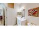 Clean bathroom with vanity, toilet, and a large mirror at 702 Rum Run # 38702, Davenport, FL 33897