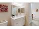 Bathroom with vanity, toilet and access to another room at 702 Rum Run # 38702, Davenport, FL 33897