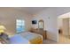 Bright bedroom with a queen bed and access to another room at 702 Rum Run # 38702, Davenport, FL 33897