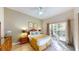 Bright bedroom with a queen bed and access to a private patio at 702 Rum Run # 38702, Davenport, FL 33897