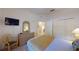 Bedroom with a queen bed, dresser, and TV at 702 Rum Run # 38702, Davenport, FL 33897